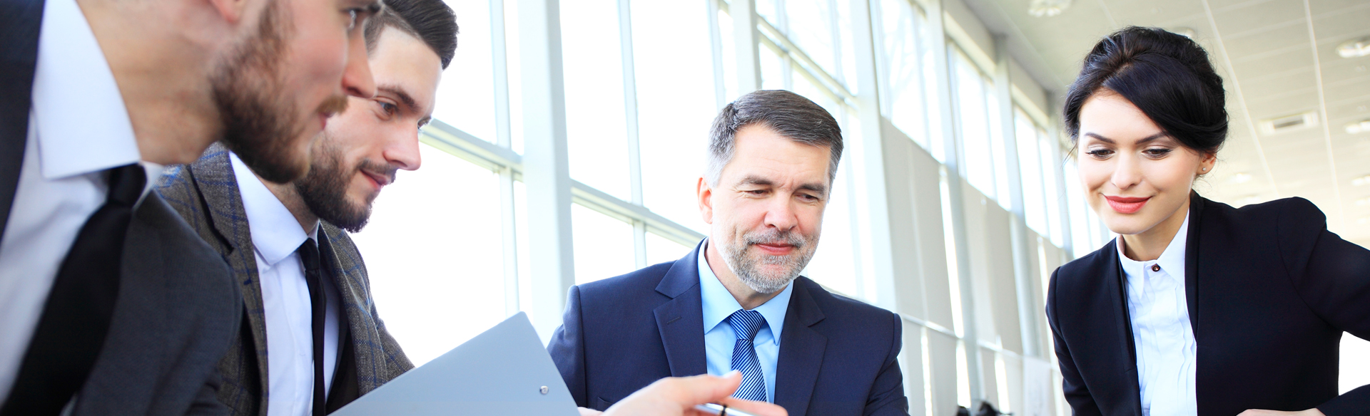 3 men, 1 woman, in office, construction consultant