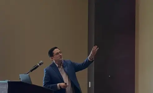 Trent Cotney speaking at an event.